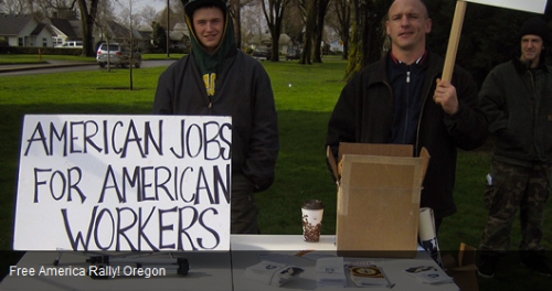 Kyle Brewster (right) sneering at Free America Rally on February 23, 2013