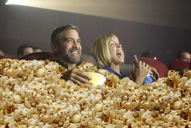 george-clooney-eating-popcorn-at-movies-